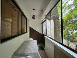 a room with a table and some windows at Paradise Beach Apartment in Boracay +55 photos