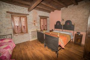Postel nebo postele na pokoji v ubytování B&B il mio Casale