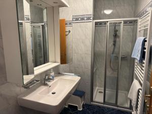 a bathroom with a sink and a shower at Lindenhof Deutsch in Bad Tatzmannsdorf