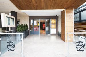 an entrance to a building with the door open at Hotel Parc & Lac in Montreux