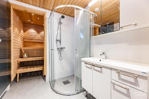 a bathroom with a shower and a sink at Holiday in Lapland - Sointuilevi A59 in Levi