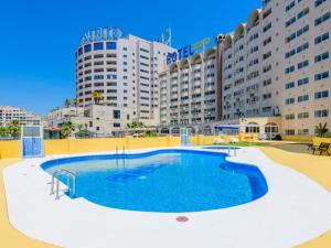 a large swimming pool in front of a large building at EL CANO MagicWorld MarinaDor in Oropesa del Mar