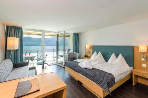 Ένα ή περισσότερα κρεβάτια σε δωμάτιο στο Hotel Alexander