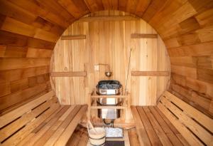 an inside view of a sauna with wooden walls at Castello do mare カステロディマーレ in Miyako Island