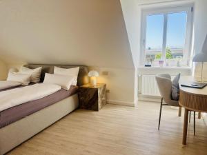 Postel nebo postele na pokoji v ubytování Lexow - Hotel an de Havenkant