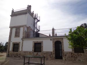 an old building with a balcony on top of it at San José in Andújar