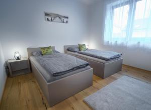 Postel nebo postele na pokoji v ubytování Apartments Poděbradova Premium