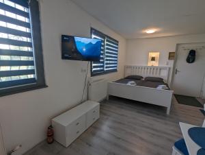 Voodi või voodid majutusasutuse Lovely studio with free parking on premisis toas