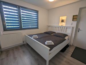 Voodi või voodid majutusasutuse Lovely studio with free parking on premisis toas