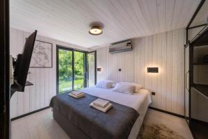 Ένα ή περισσότερα κρεβάτια σε δωμάτιο στο Mur mur cottage