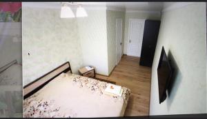 a small room with a bed and a room with a unintention at Vilari Odessa in Odesa +20 photos
