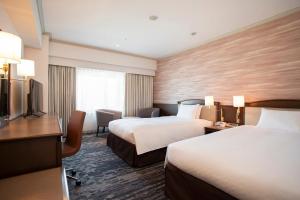 Кровать или кровати в номере Hotel Nikko Kansai Airport - 3 mins walk to the airport