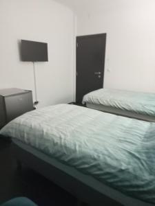 Postel nebo postele na pokoji v ubytování Rezidencija Arion