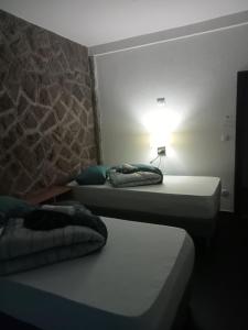 Postel nebo postele na pokoji v ubytování Rezidencija Arion