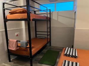 Voodi või voodid majutusasutuse NIRMAN HOMESTAY 5 minutes walk to beach toas