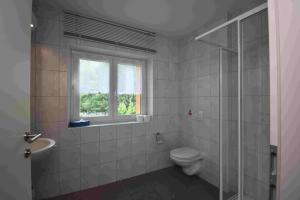 A bathroom at Ferienwohnung Dackel