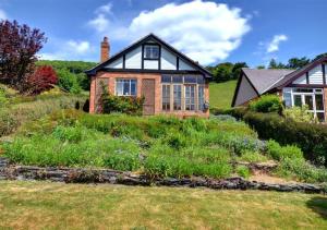 a house on a hill with a garden at Bron y Fedw in Glyn-Ceiriog