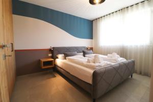 Postel nebo postele na pokoji v ubytování Residence Montani
