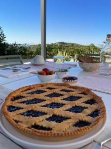 a pie sitting on top of a table at Nostos - Casale e Permacultura in SantʼAgata sui Due Golfi