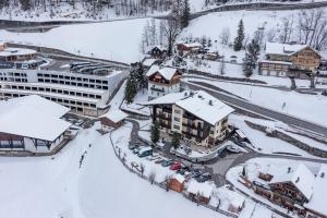 an aerial view of a resort in the snow at Pension Trojerhof in Heiligenblut
