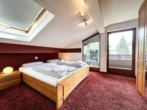 En eller flere senge i et værelse på FEWO Calendula