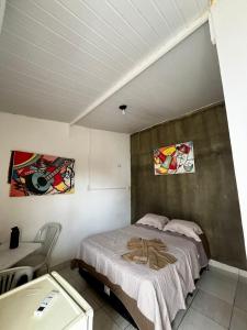 a bedroom with a bed in a room at Recanto Canoa - Canoa Quebrada in Aracati