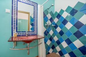 a bathroom with a red sink and a mirror at Alvor Ar de Mar in Alvor +43 photos