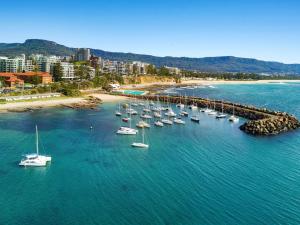 an aerial view of a harbor with boats in the water at Marlo's Escape - A Generous Haven for Couples in Wollongong