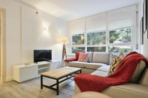 Televízia a/alebo spoločenská miestnosť v ubytovaní Luderna - Apartamento Mirador de Saumet