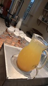 a pitcher of orange juice sitting on a counter at Efstratios Hotel in Loutra Edipsou