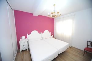 Postel nebo postele na pokoji v ubytování Zona Centro II Orangecosta