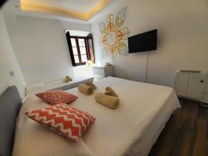 Säng eller sängar i ett rum på BLife Faro City Life private rooms