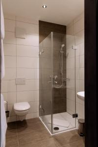 Koupelna v ubytování Heufeldboardinghouse + 48 fotografií