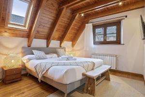 Posteľ alebo postele v izbe v ubytovaní Luderna - Dúplex Gessa C11