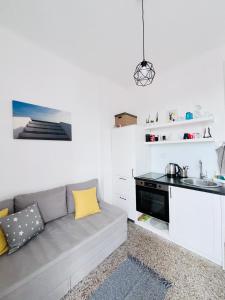a living room with a couch and a kitchen at You will love it, in Vracar in Belgrade
