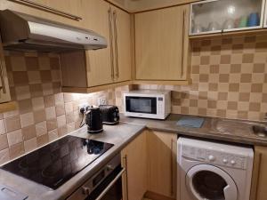 Η κουζίνα ή μικρή κουζίνα στο 2 Bed Flat - Sleeps 4 - Parking - Wifi