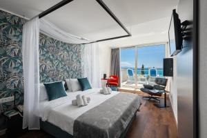 MASLINICA Mimosa Lido Palace Hotel客房内的一张或多张床位