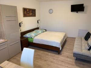 Postel nebo postele na pokoji v ubytování Apartements Studio 964
