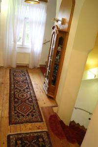 a room with a rug on the floor and a window at Pension - Alt - Strassgang in Graz
