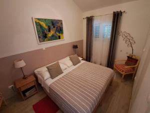 Postel nebo postele na pokoji v ubytování Apartments Oaza