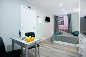 TV a/nebo společenská místnost v ubytování Família Dória Nóbrega Estúdio