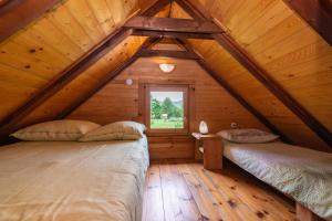 Postel nebo postele na pokoji v ubytování Chalets Zelena Vrata