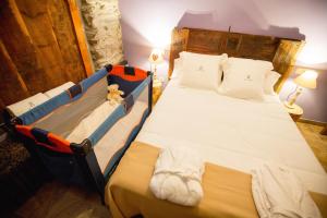 Postel nebo postele na pokoji v ubytování R de Rural - Casa Rural de les Arnes