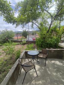 a table and two chairs sitting next to a table at MariElla in Akhaltsikhe
