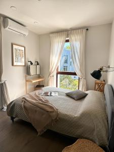 Ένα ή περισσότερα κρεβάτια σε δωμάτιο στο IVIS House - Cozy Seaside Apartment at "Šventosios Vartai" P-1