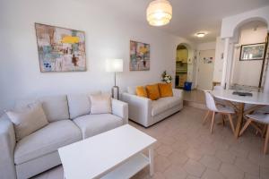 a living room with a couch and a table at PINOS 22 MENYBER in Nerja