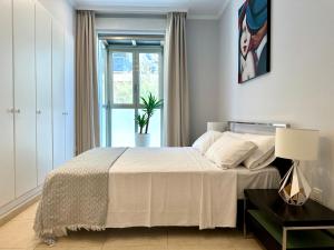 Posteľ alebo postele v izbe v ubytovaní Reinapart Patacona Beachfront Seaview
