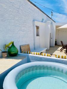 a swimming pool in the middle of a house at Villa Filou in Santa Lucia