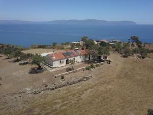 an aerial view of a house with the ocean in the background at Kalamitsi House 2 in Agia Pelagia