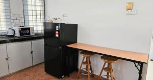 Photo de la galerie de l'établissement Beril Homestay Full Aircond, Free Wifi, Netflix, Water Filter, à Paka